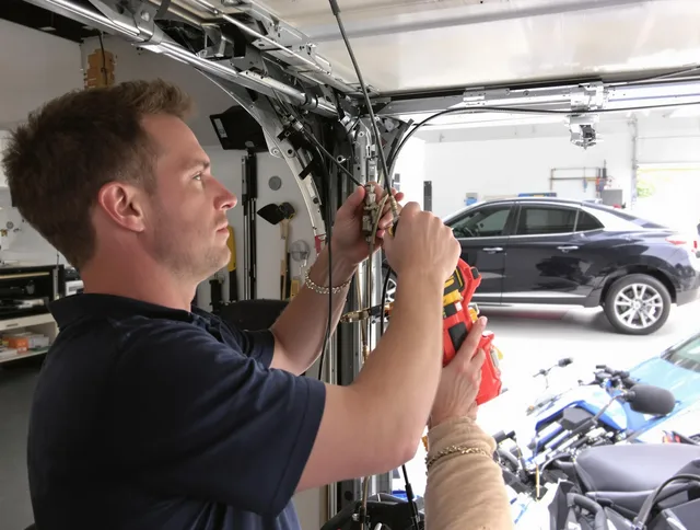 Ipswich Garage Door Repair safety certified technician performing cable replacement in Ipswich
